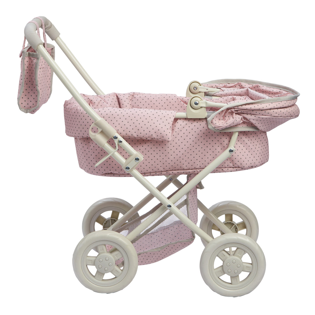 The baby doll buggy with the canopy down, pink with gray polka dots.