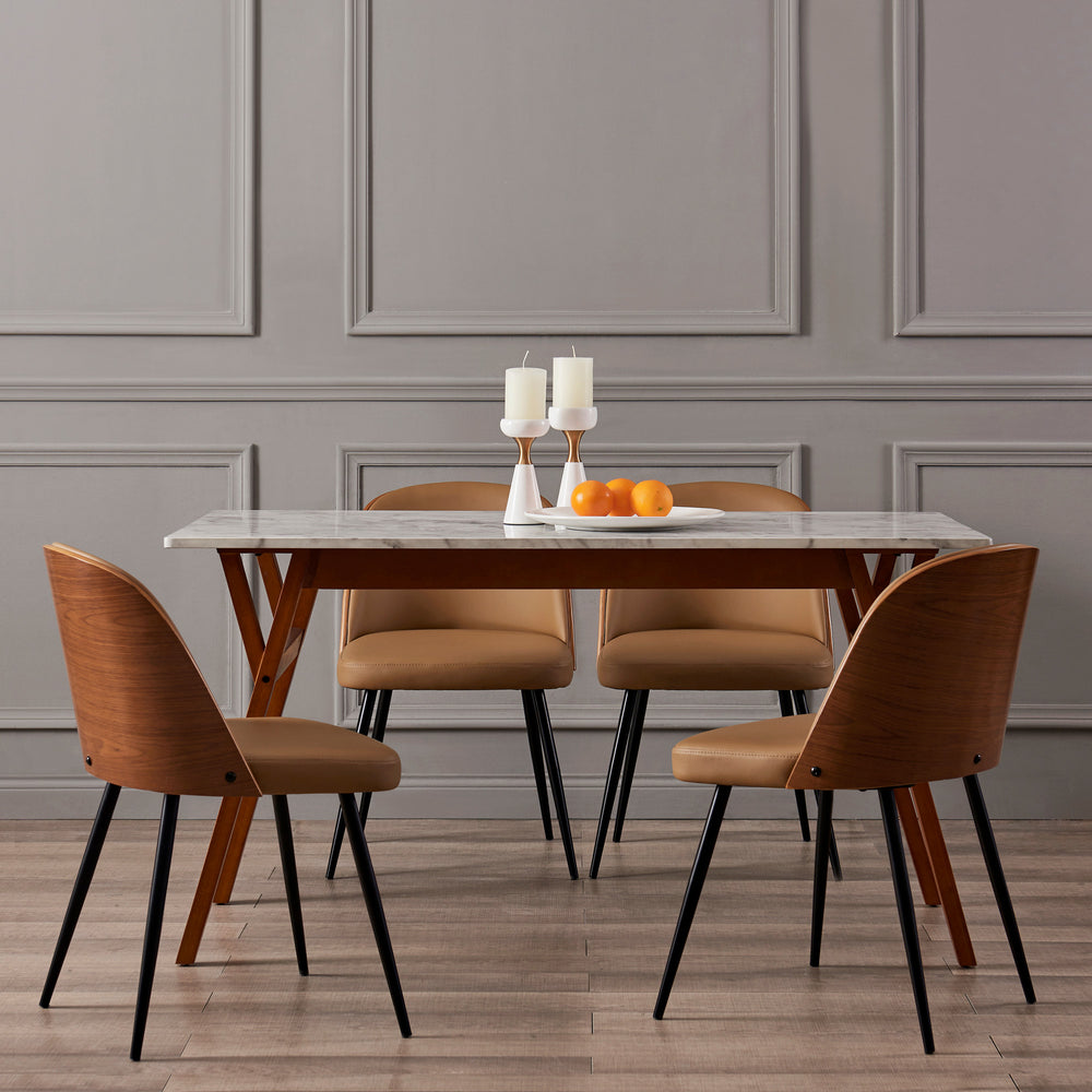 A dining table srrounded by Teamson Home Layton Khaki Faux Leather Dining Chairs with Black Tapered Legs