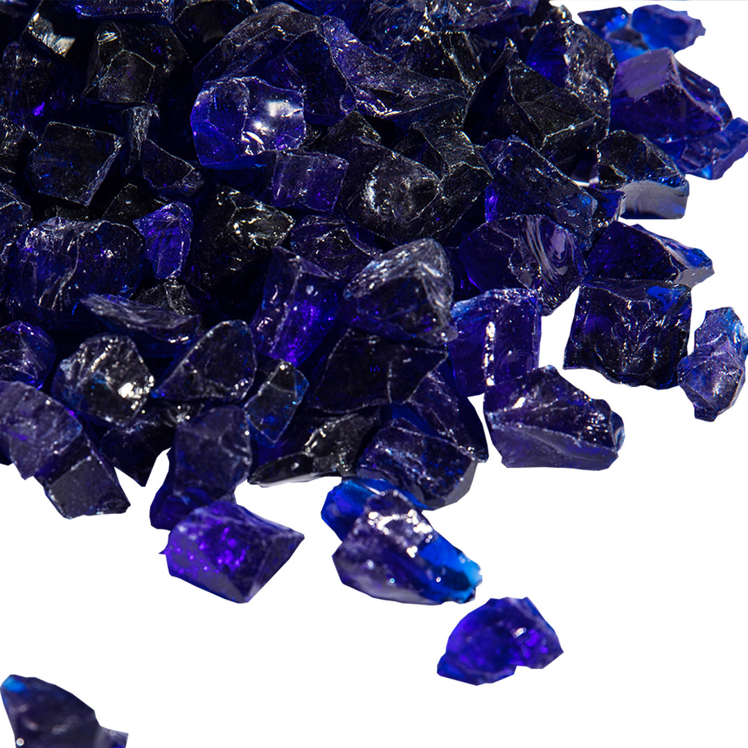 A pile of Teamson Home 1/2 Inch Reflective Blue Fire Glass pieces on a white background.
