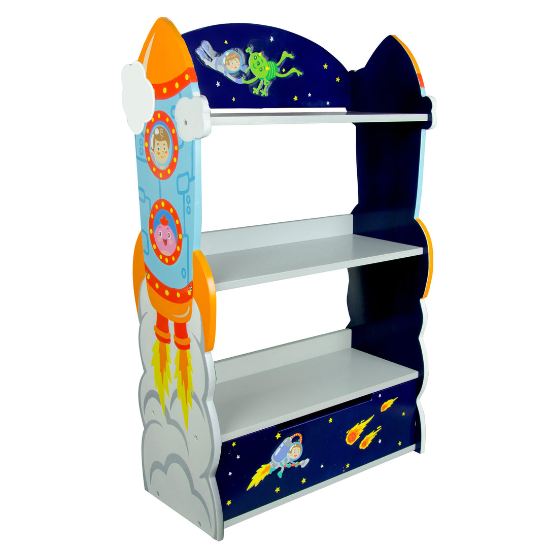 A Fantasy Fields Kids Wooden Outer Space Bookshelf with Drawer, Blue from the Outer Space collection, with rocket ships, astronauts, stars, comets and aliens illustrated on the shelving unit.