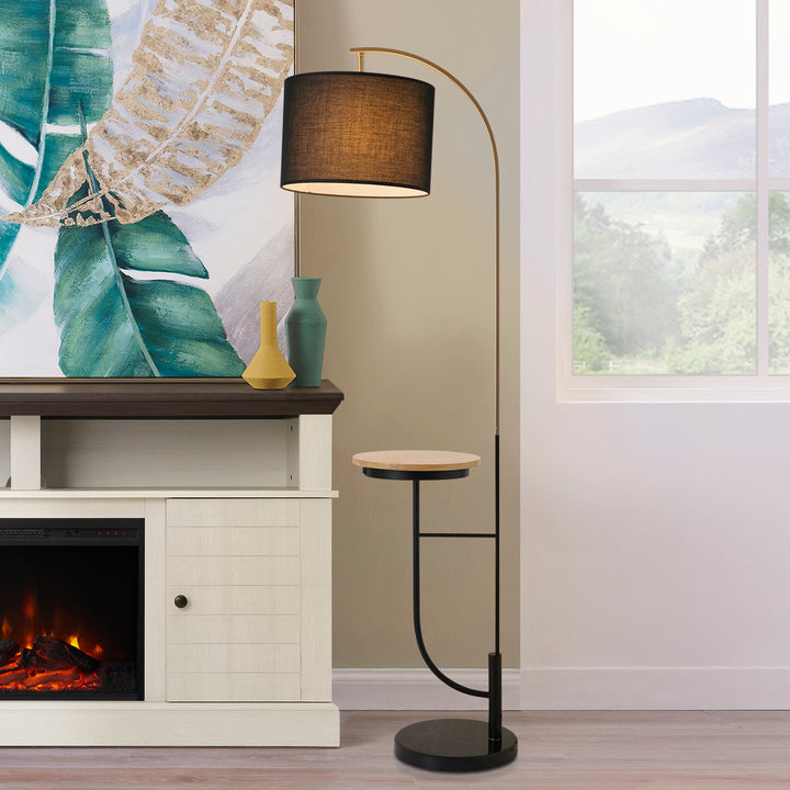 A living room with a fireplace and a Teamson Home Danna Floor Lamp with Marble Base and Built-In Table, Black